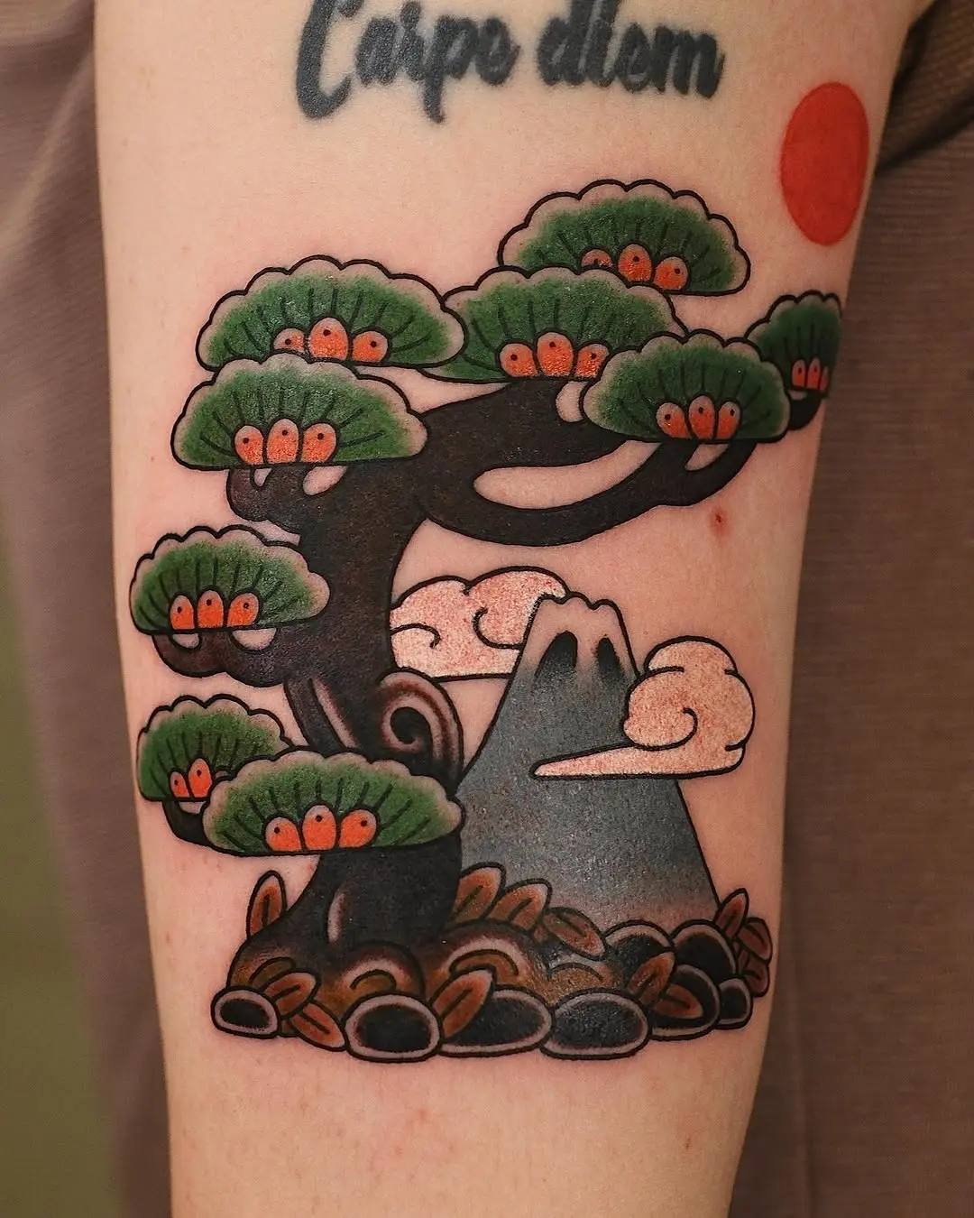 Stunning bonsai tattoo with mountain backdrop