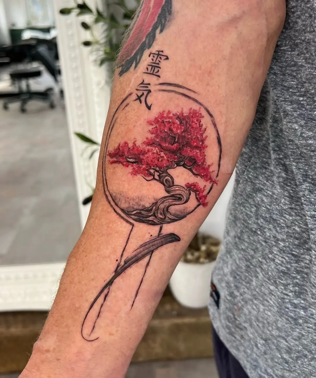 Stunning bonsai tattoo with vibrant red hues