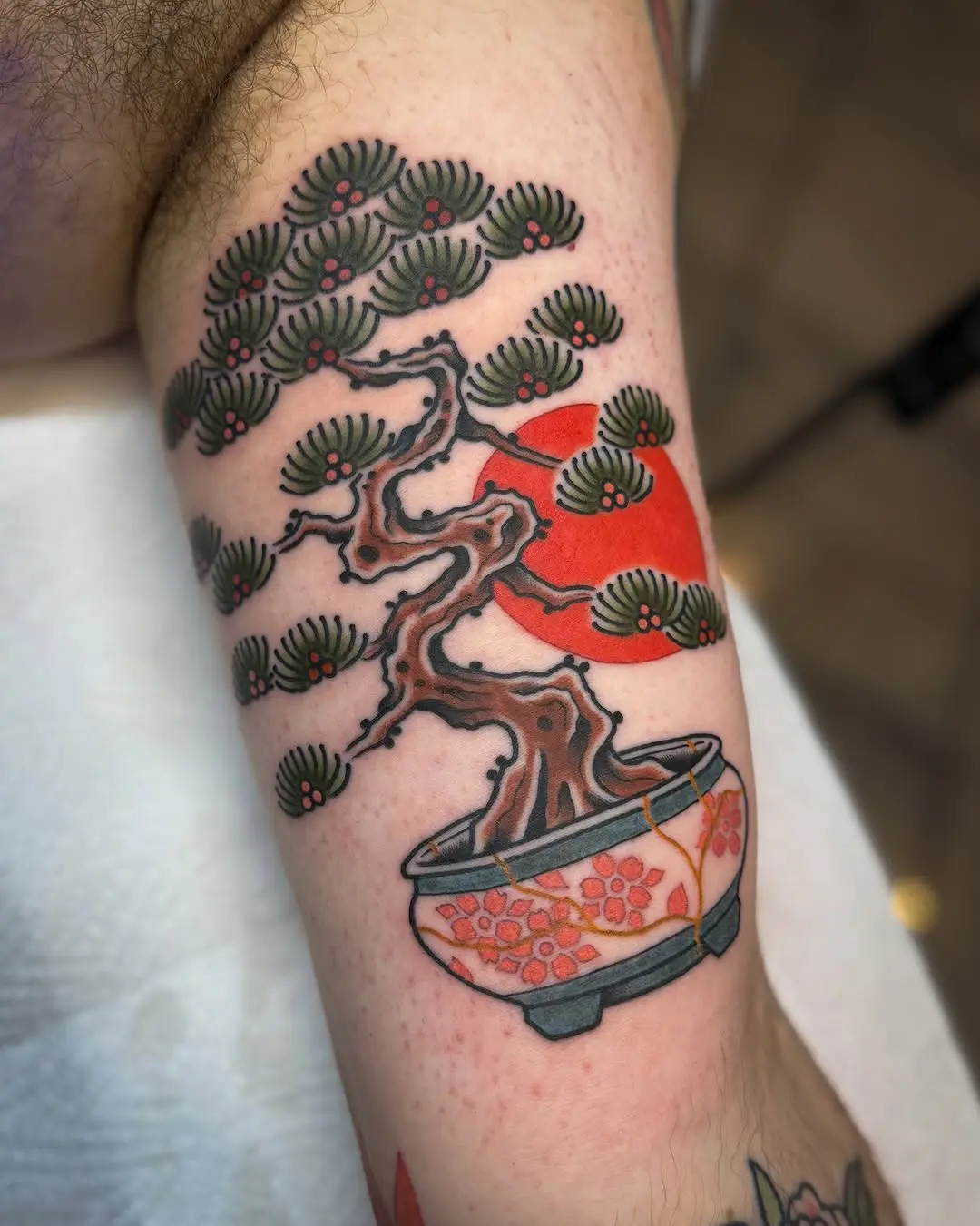 Intricate bonsai tattoo with vibrant colors