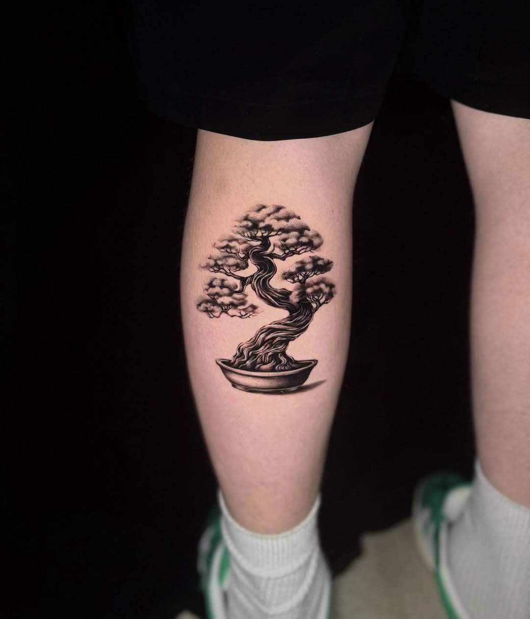 Intricate bonsai tattoo in black and gray