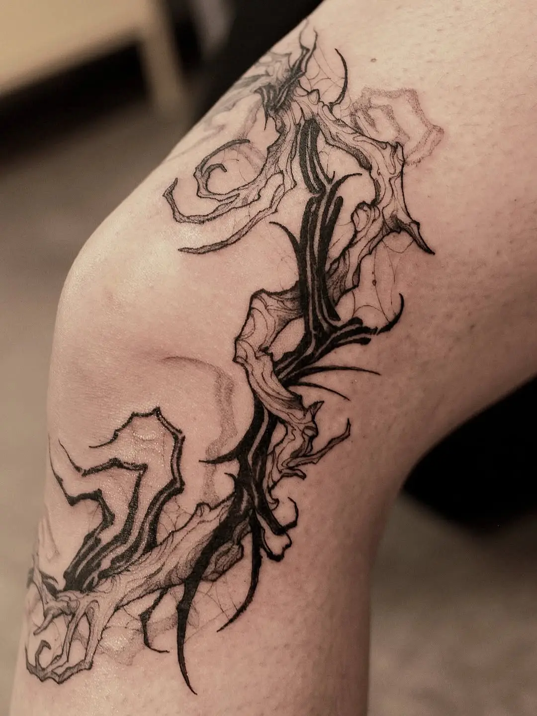 Stylish black and gray branch tattoo design