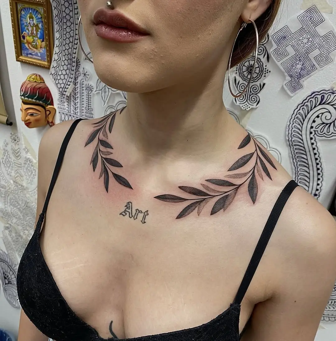 Elegant branch tattoo enhancing feminine charm
