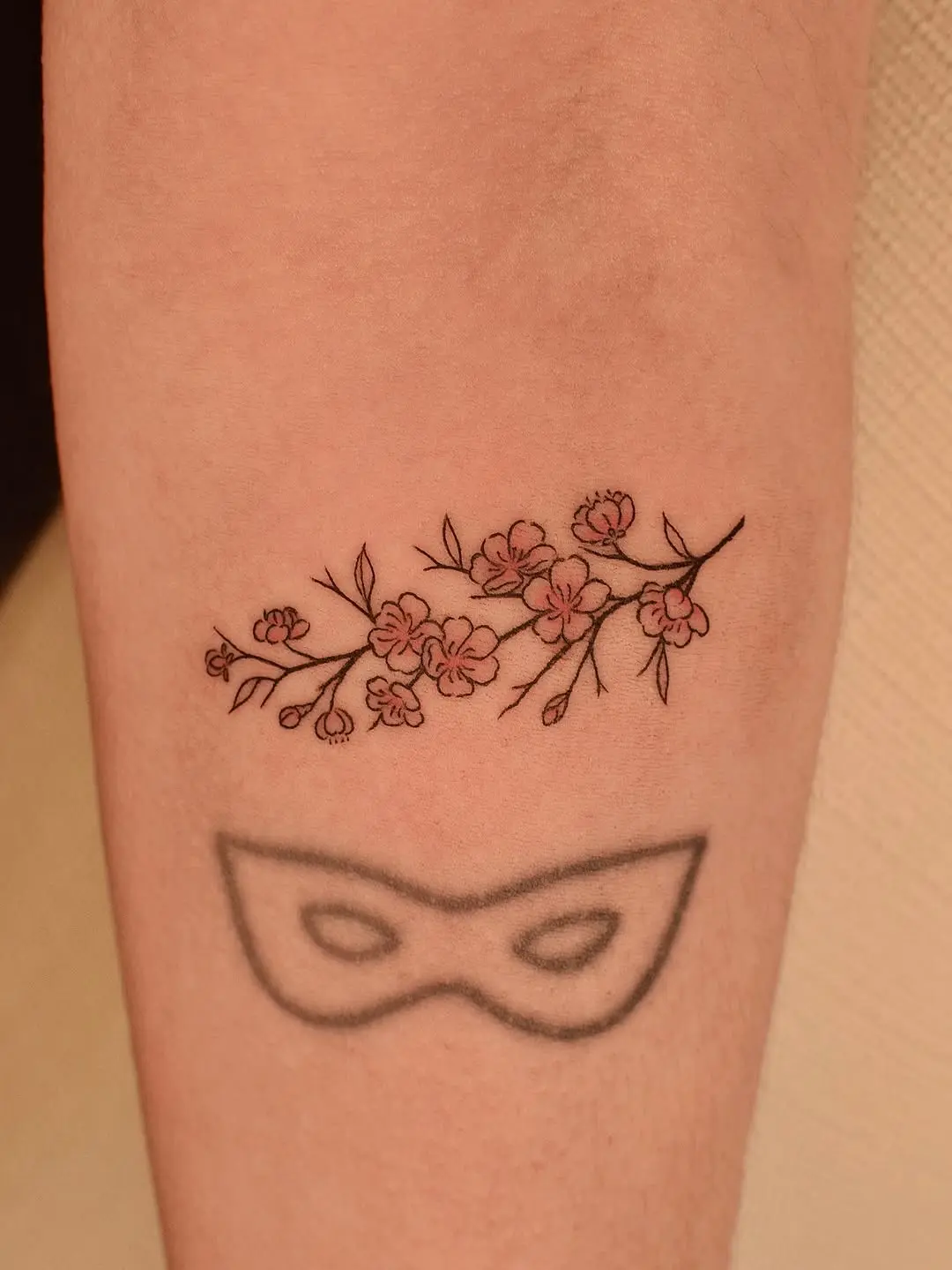 Delicate Branch Tattoo with Blossoms