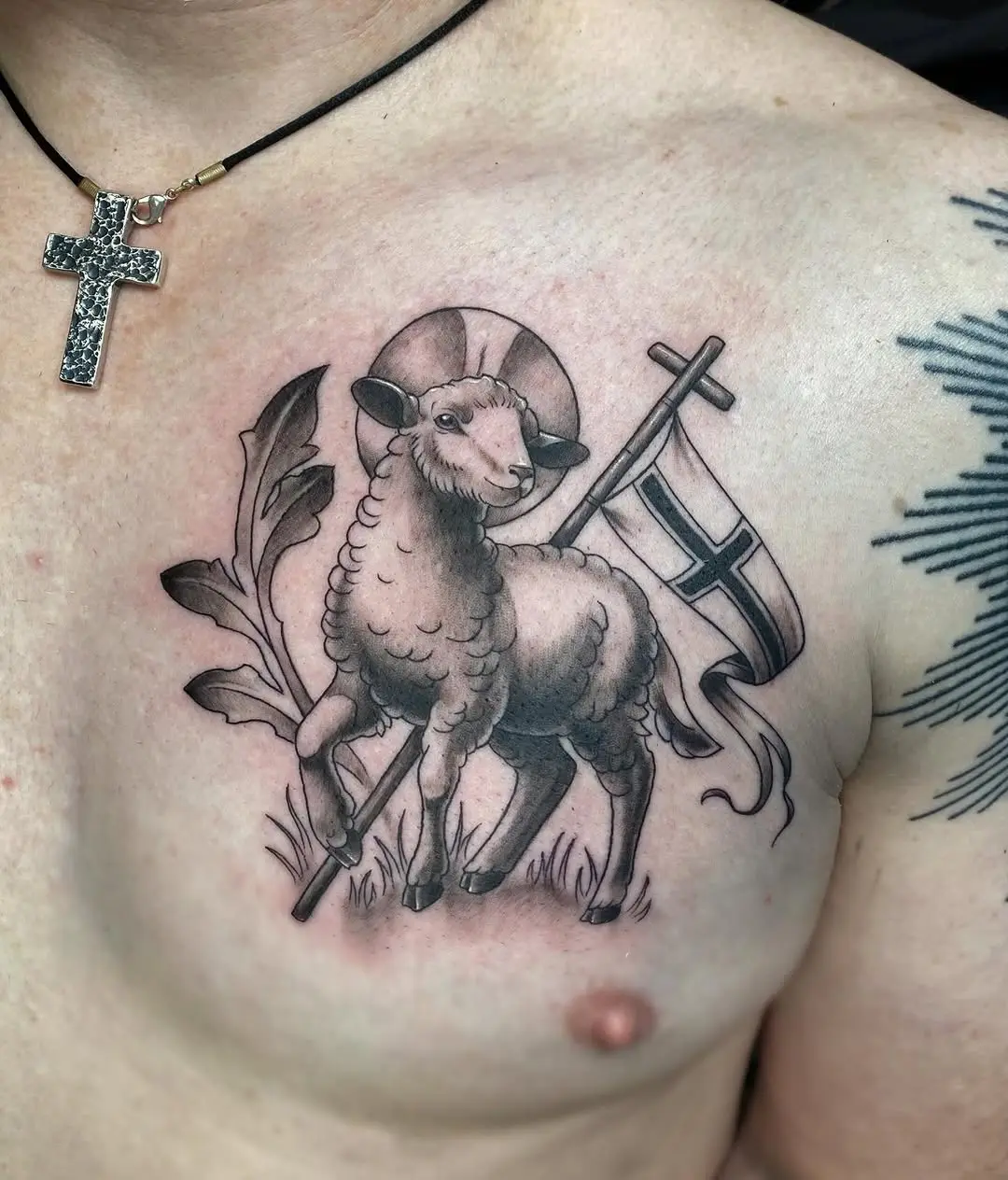 Symbolic sheep tattoo with religious significance