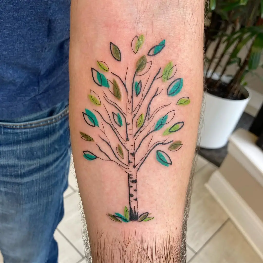 Vibrant birch tree tattoo with colorful leaves