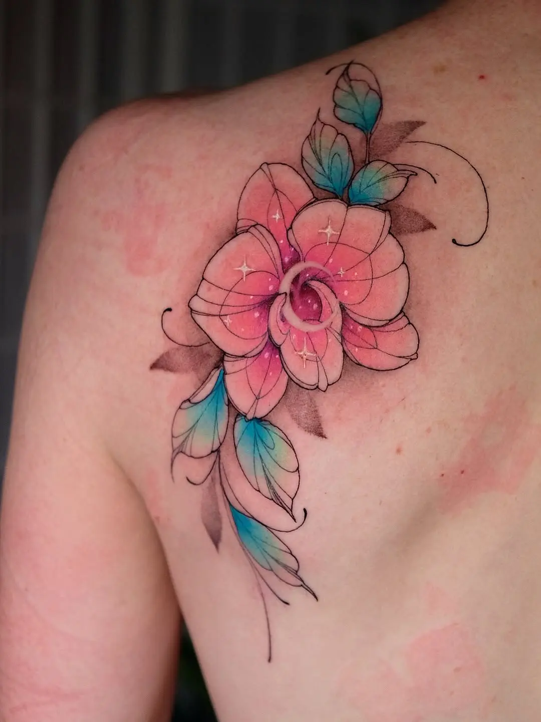 Elegant and colorful orchid tattoo design
