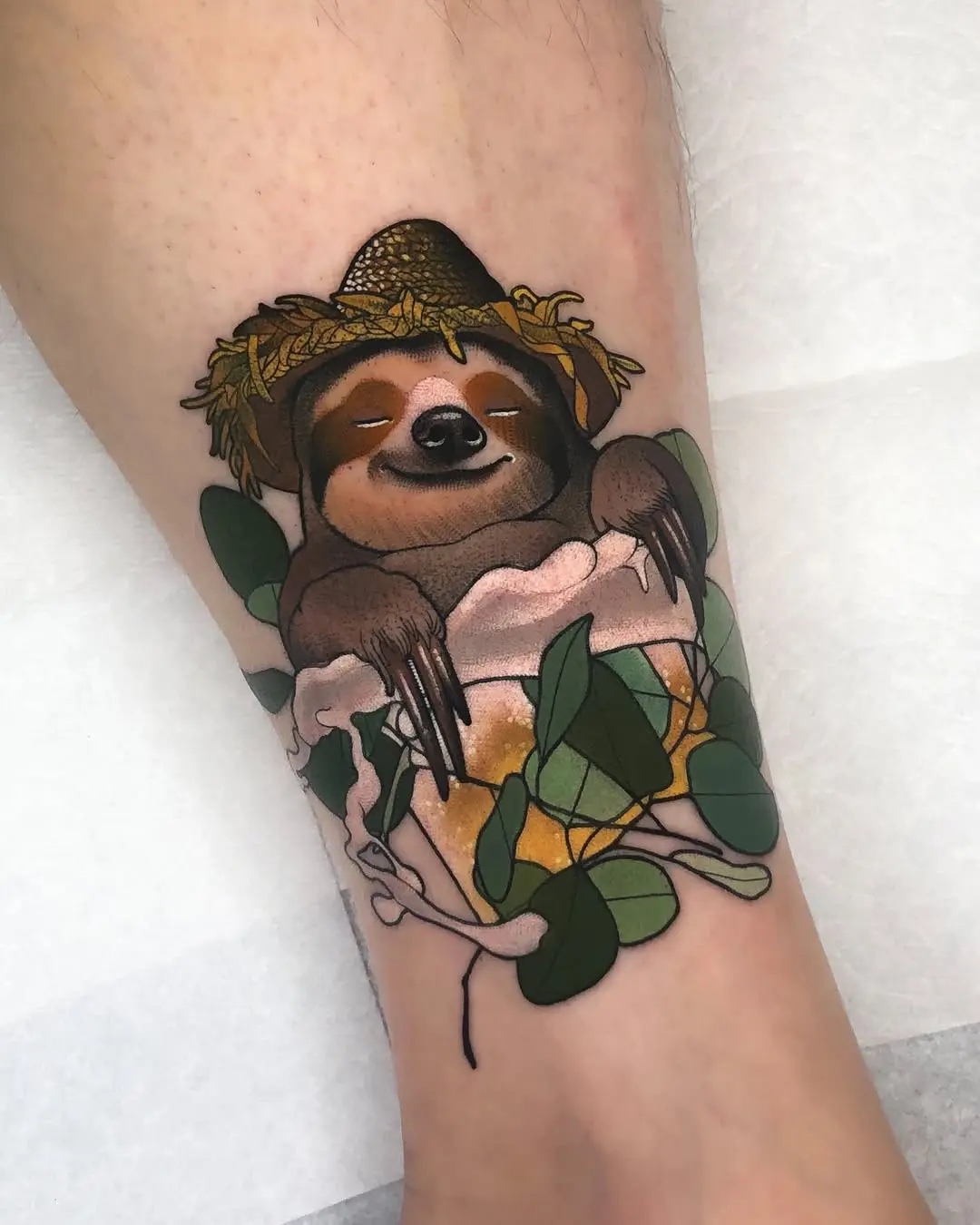 Charming sloth tattoo with a straw hat