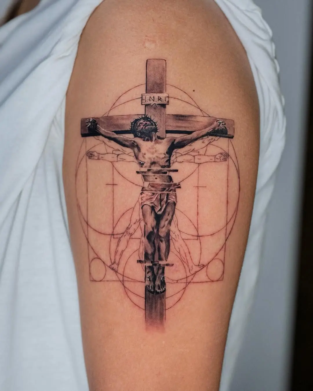 Intricate crucifixion tattoo blending art and faith