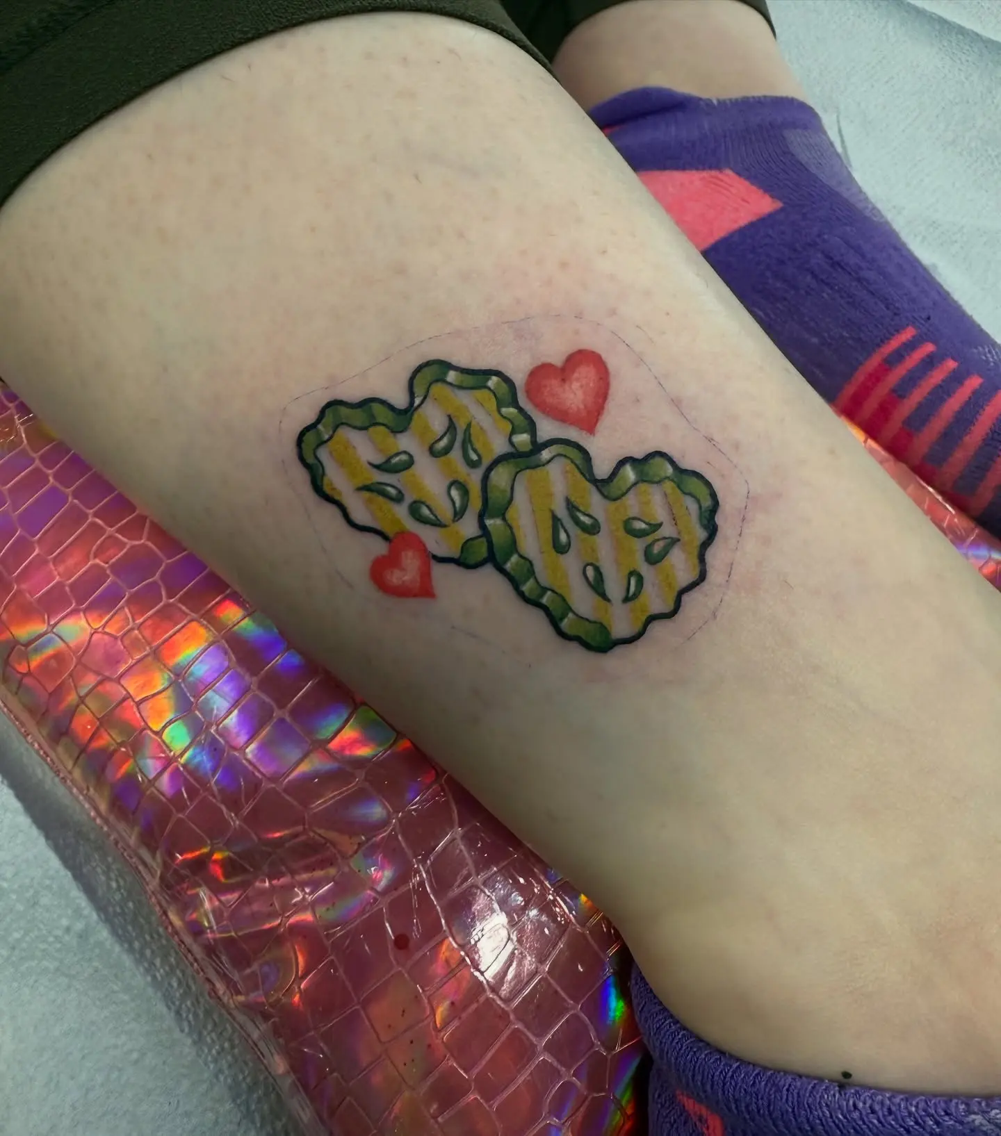 Adorable pickle tattoo with love hearts