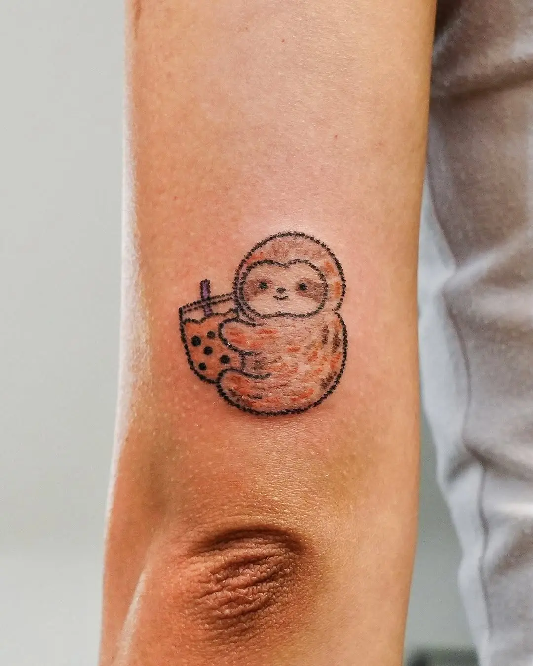 Charming sloth enjoying a bubble tea treat