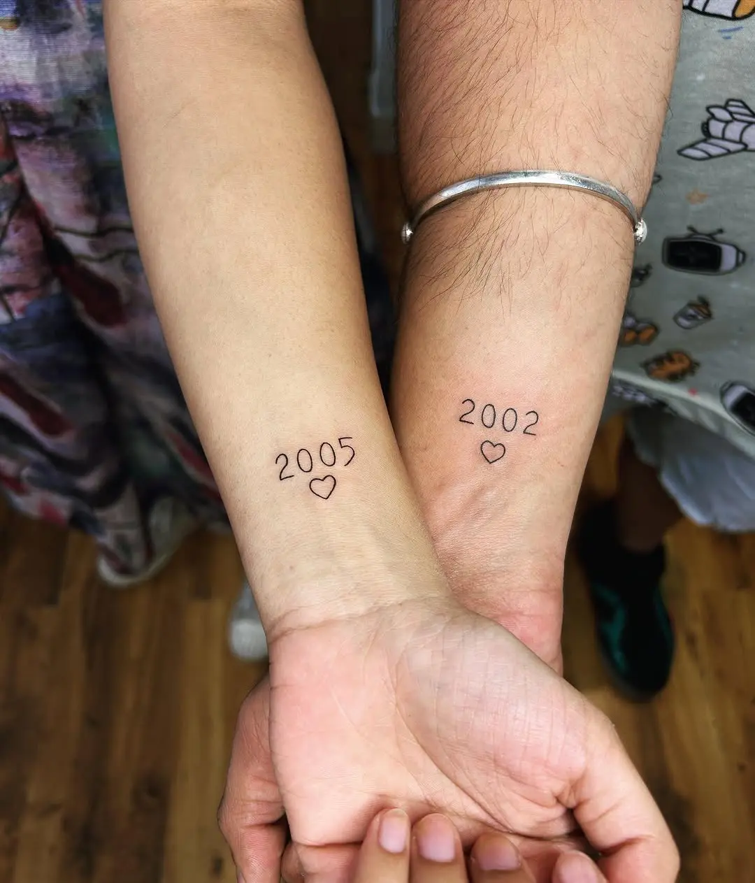 Meaningful date tattoos with heart symbols
