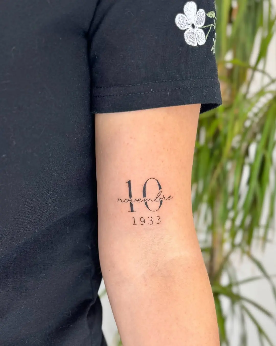 Elegant date tattoo capturing a memorable moment