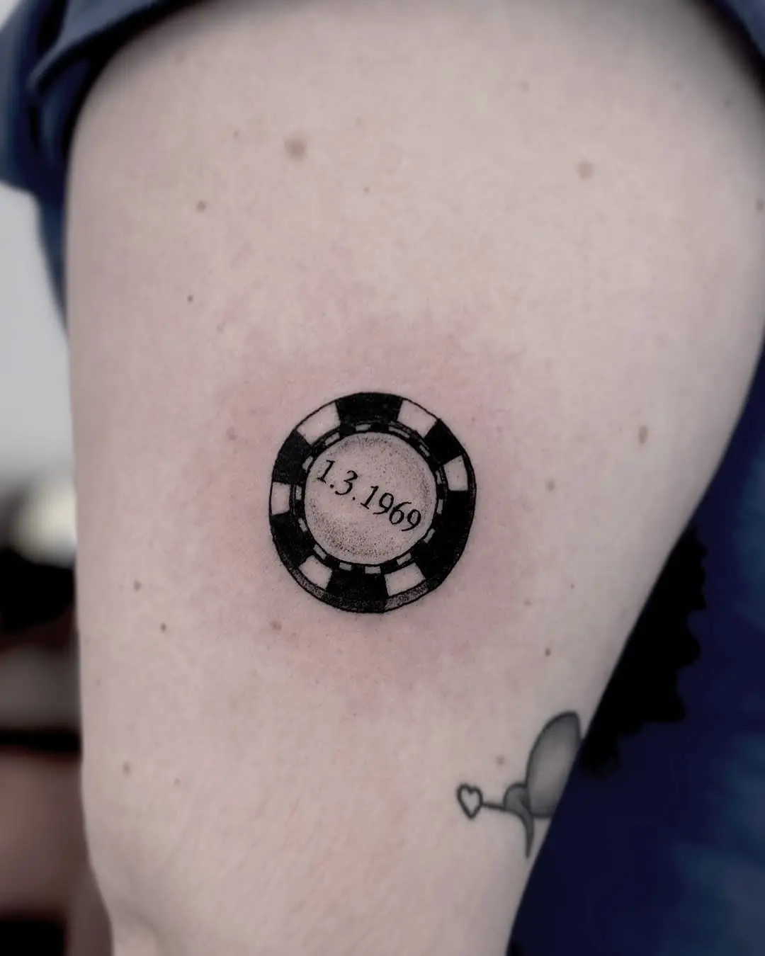 Meaningful date tattoo on poker chip