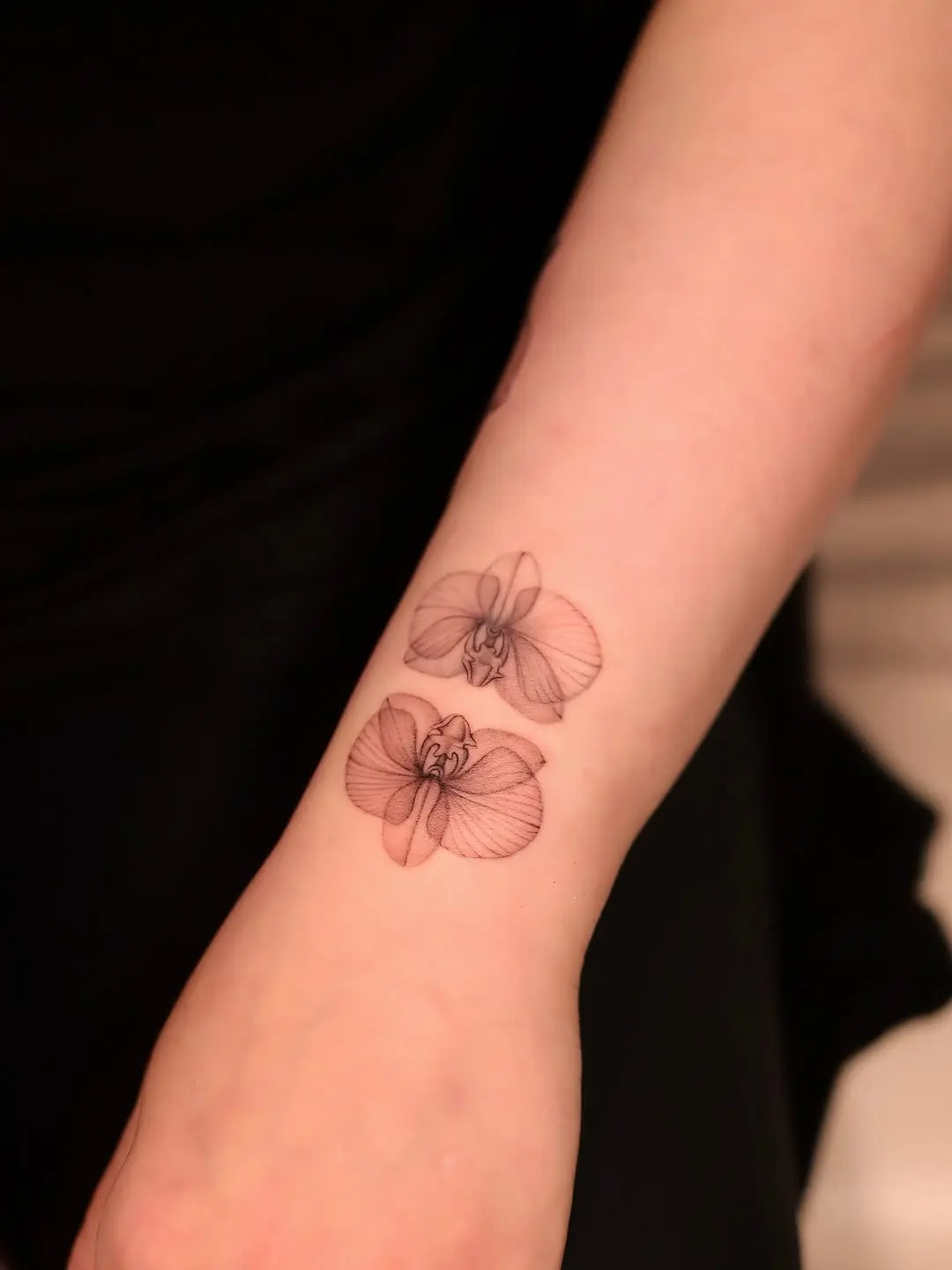 Elegant and intricate orchid tattoo design