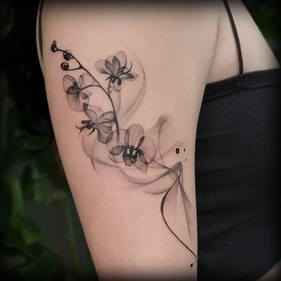 Stylish black orchid tattoo on arm