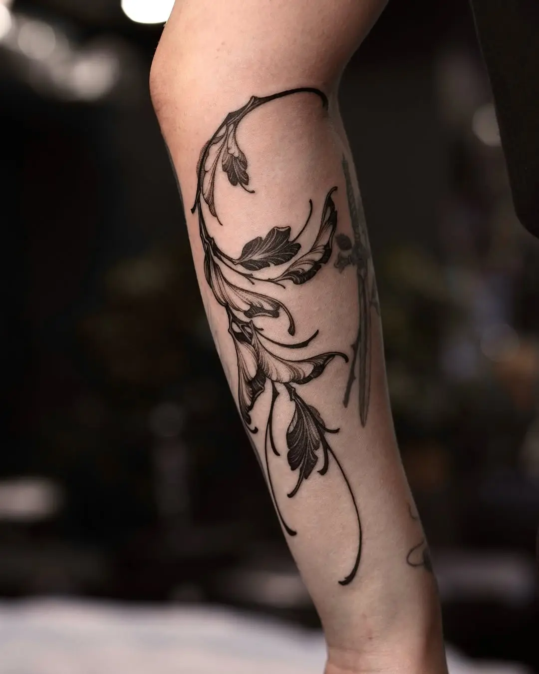 Elegant branch tattoo design on the forearm