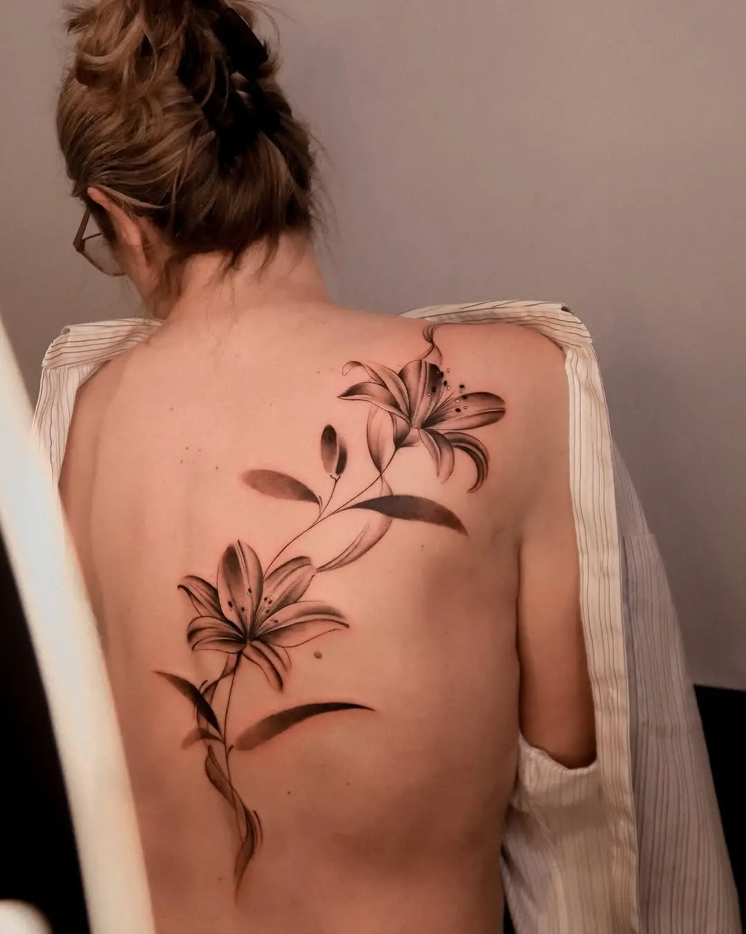 Stunning Back Lily Tattoo Design