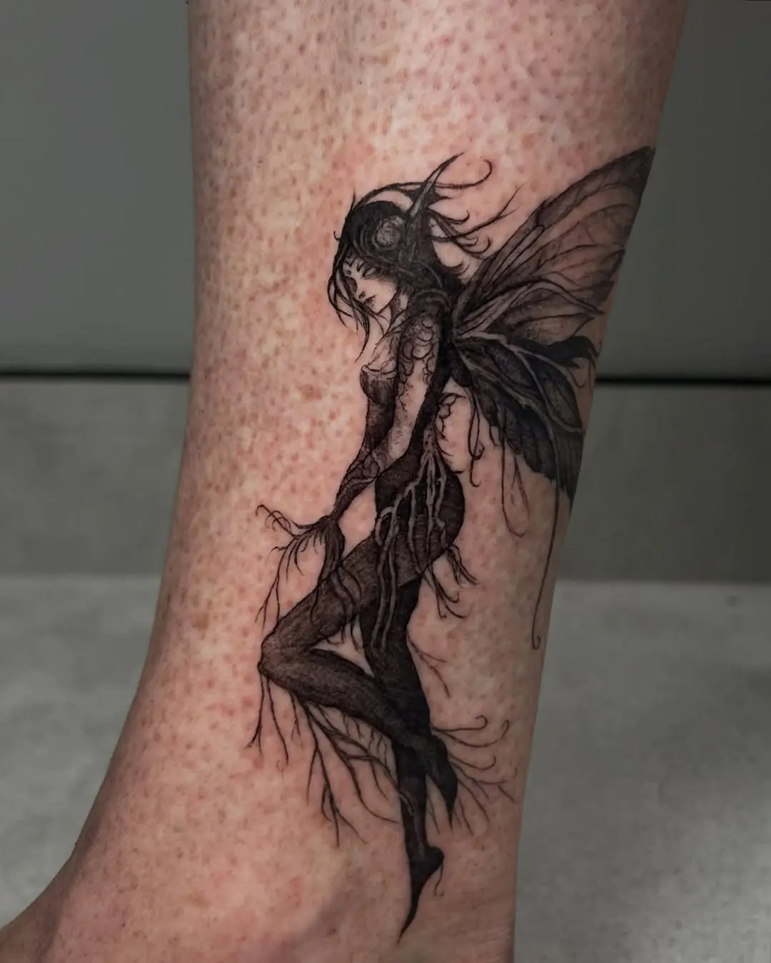 Whimsical fairy tattoo with striking details