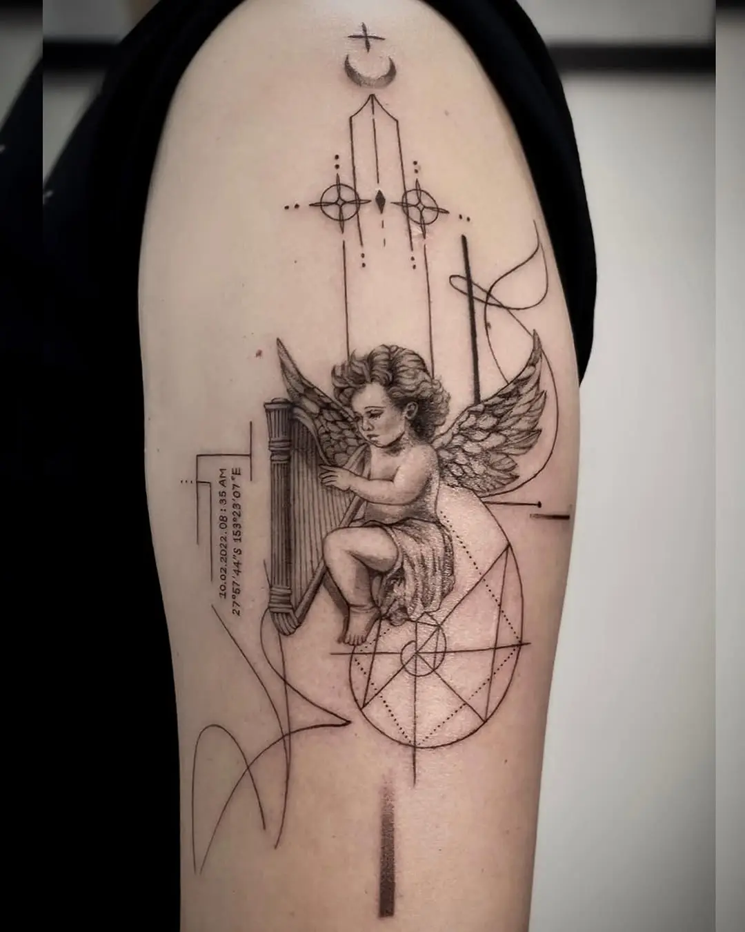Graceful angel tattoo with geometric elements