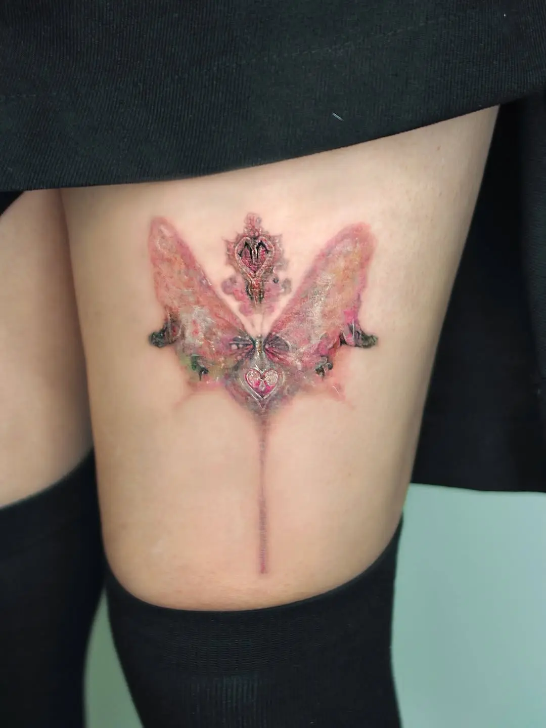 Stunning ethereal butterfly tattoo with intricate details