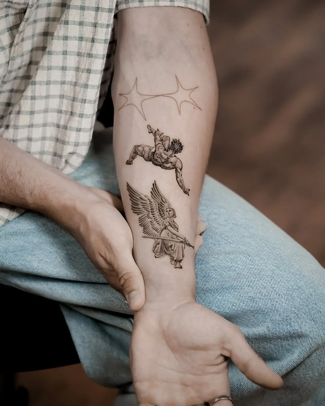 Divine beings depicted in ethereal tattoo design
