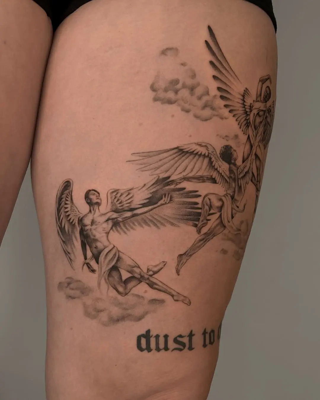 Angelic beings grace this stunning tattoo