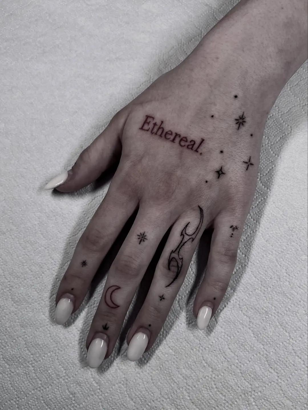 Ethereal Hand Tattoos with Celestial Touches