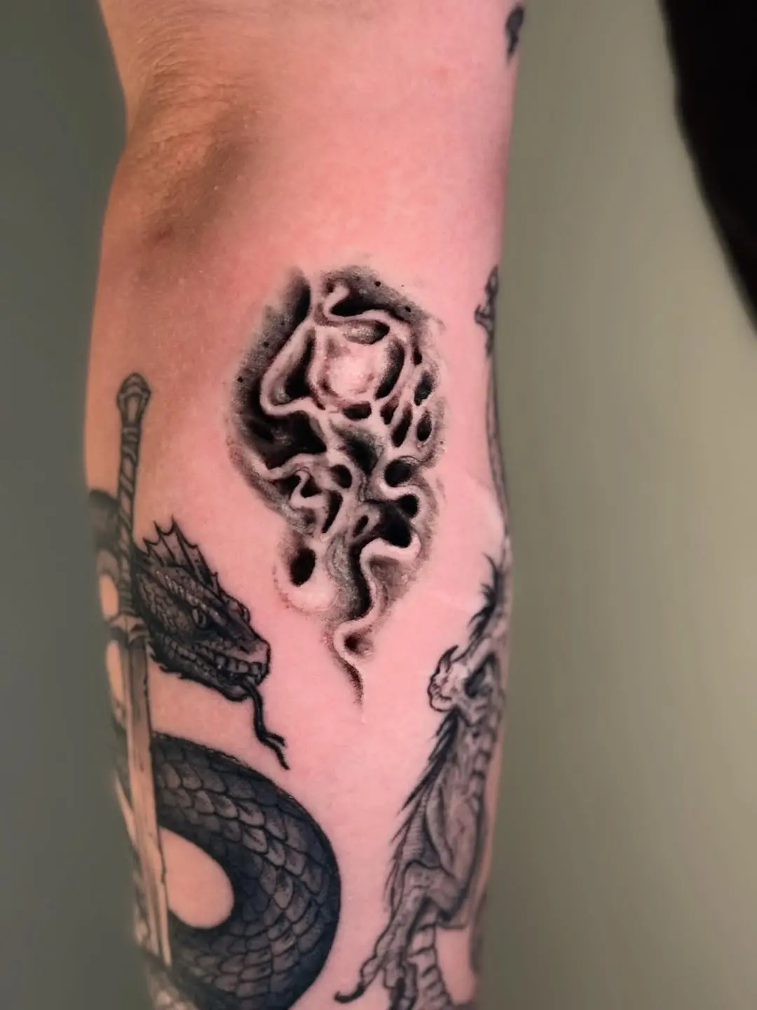 Ethereal smoke design tattoo on forearm