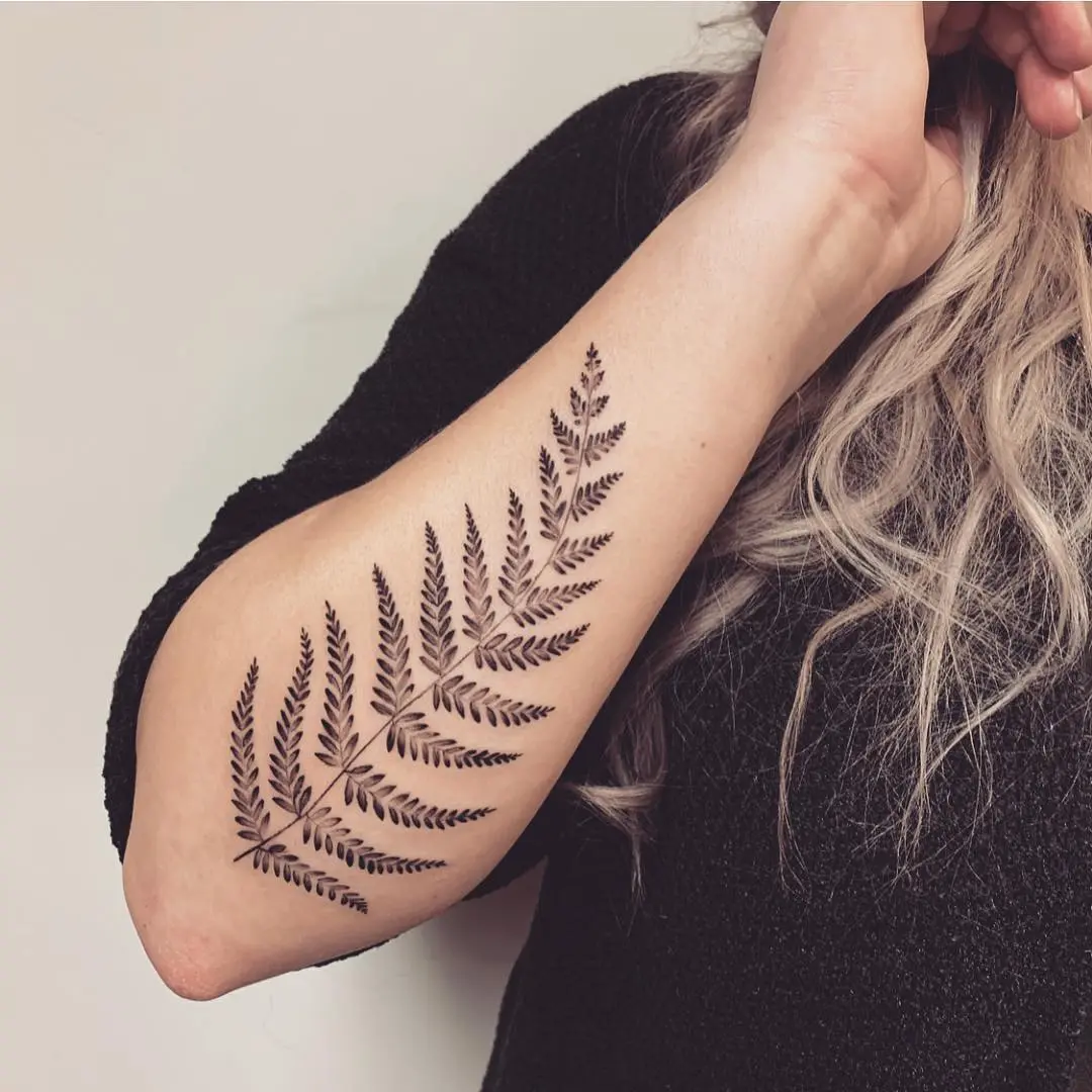 Elegant fern leaf tattoo showcasing natural beauty.