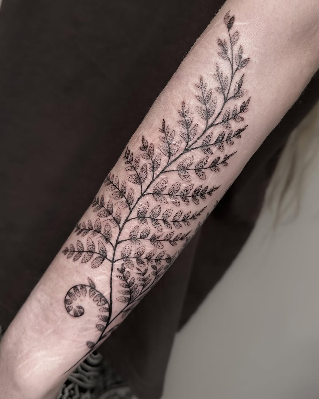 Elegant fern leaf tattoo with intricate details