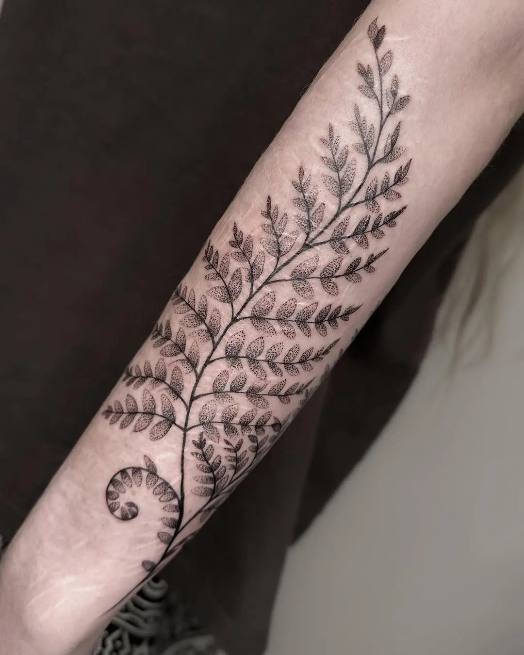 Elegant fern leaf tattoo with intricate details