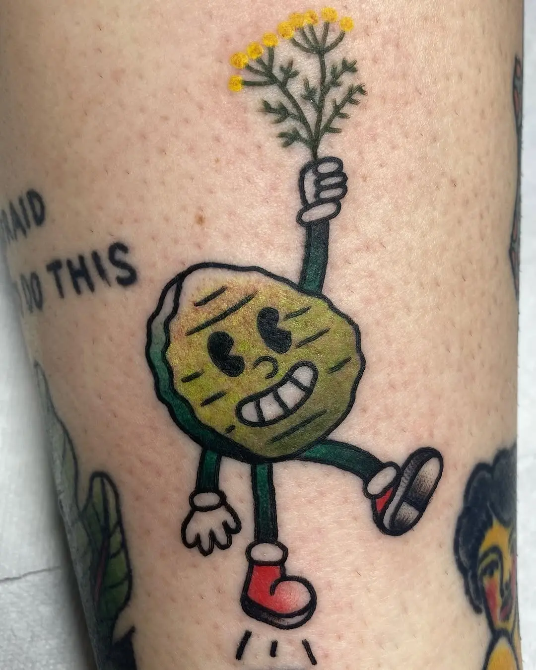 Playful pickle tattoo with a cheerful vibe