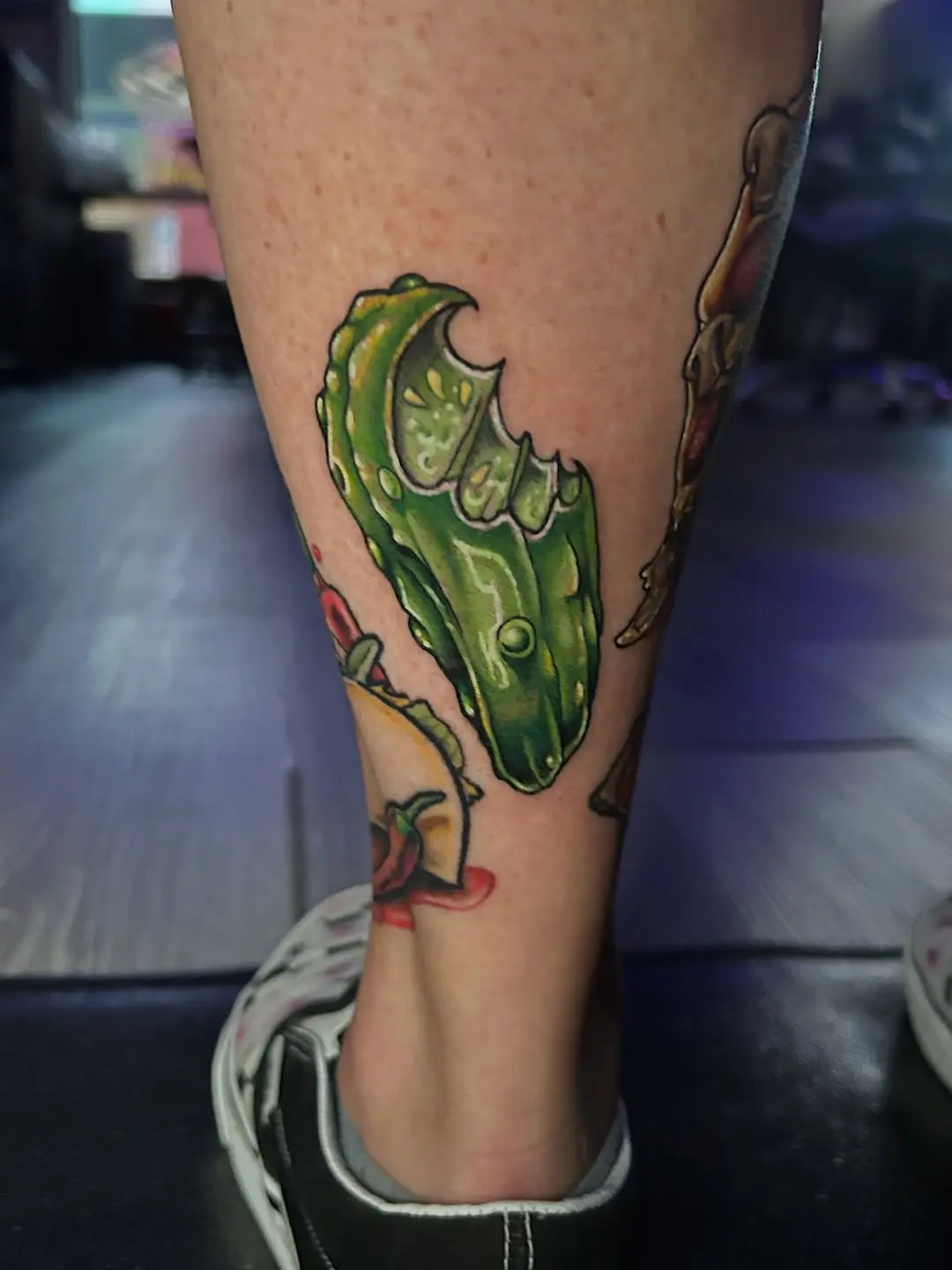 Vibrant pickle tattoo adds unique flair