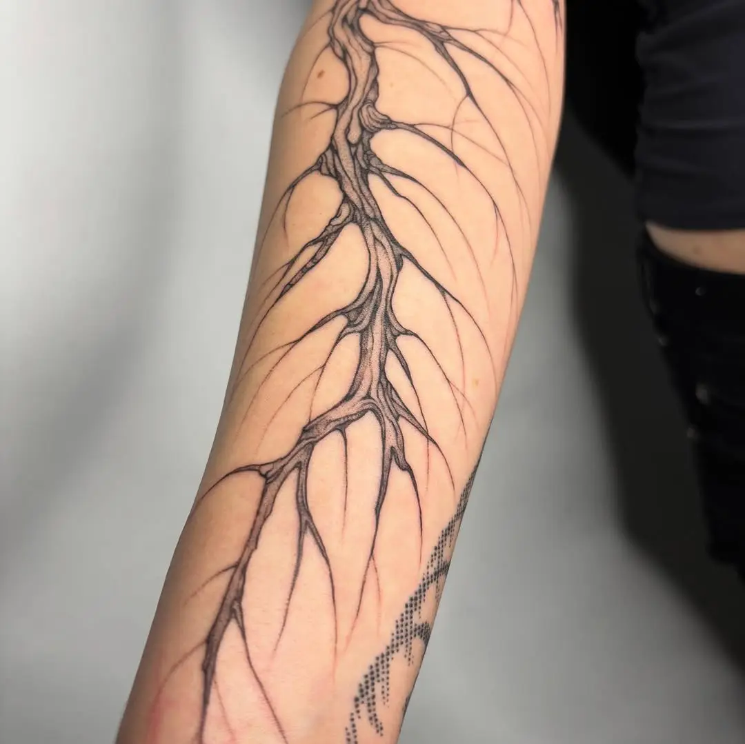 Detailed branch tattoo showcasing organic elegance