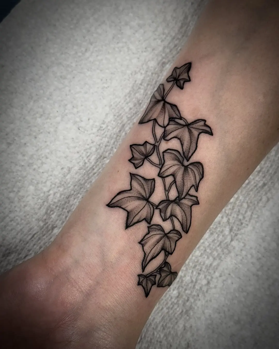 Elegant ivy tattoo showcasing intricate linework details