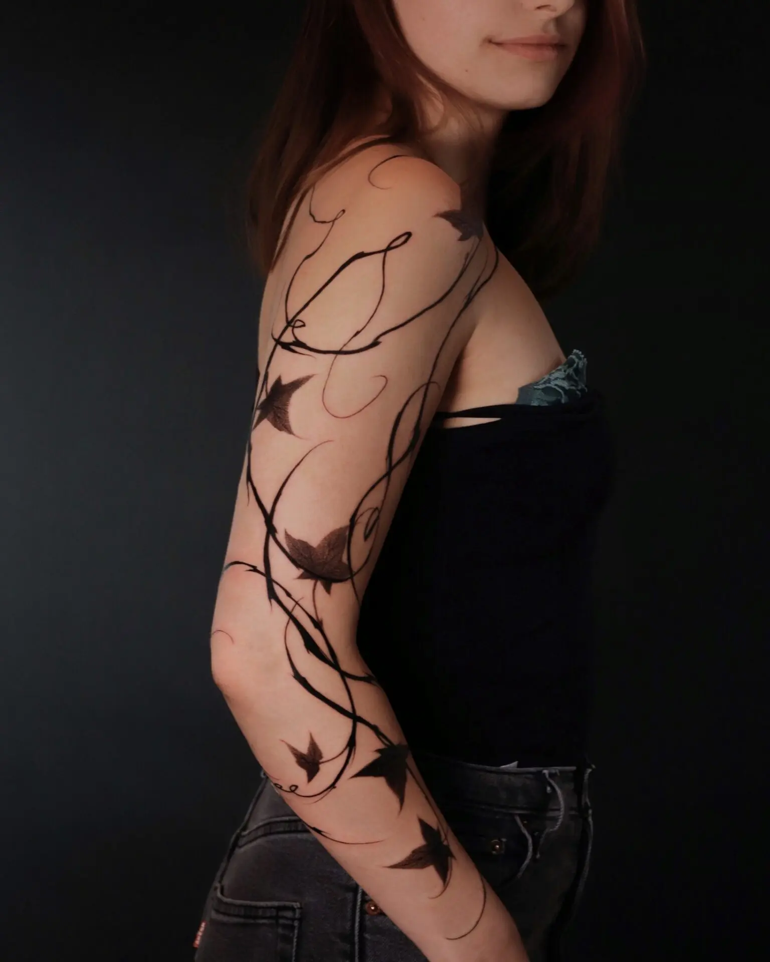 Elegant ivy tattoo enveloping the arm