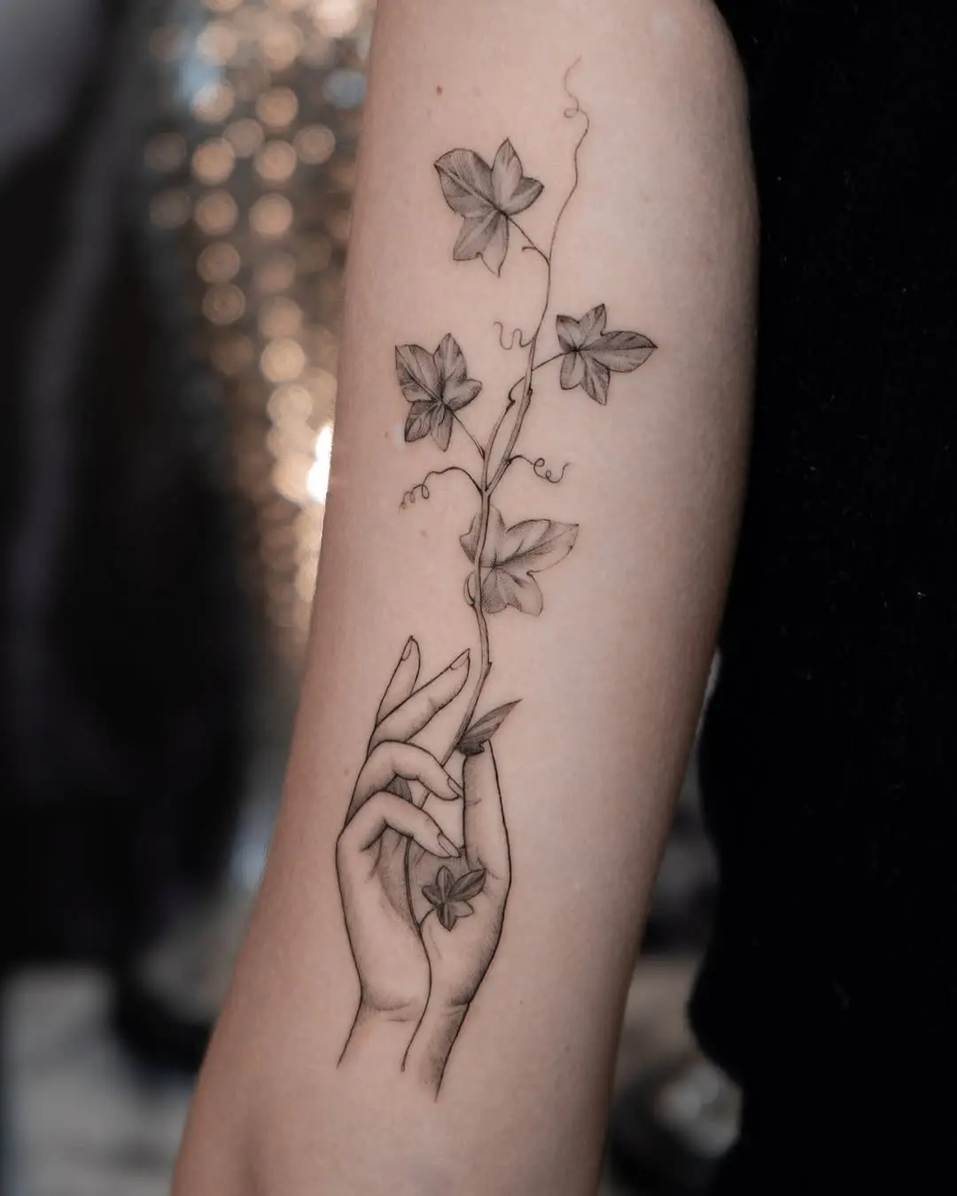 Elegant Ivy Tattoo Embracing a Delicate Hand