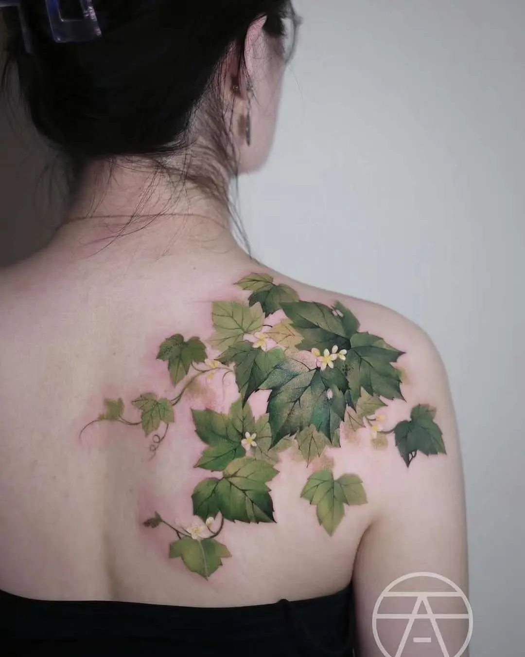 Elegant Ivy Tattoo Design on the Back