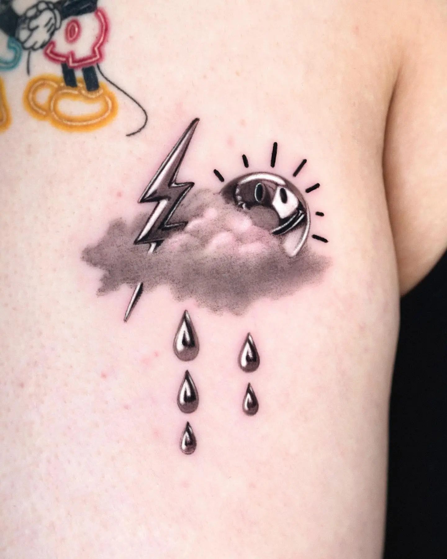Striking lightning bolt tattoo with atmospheric elements