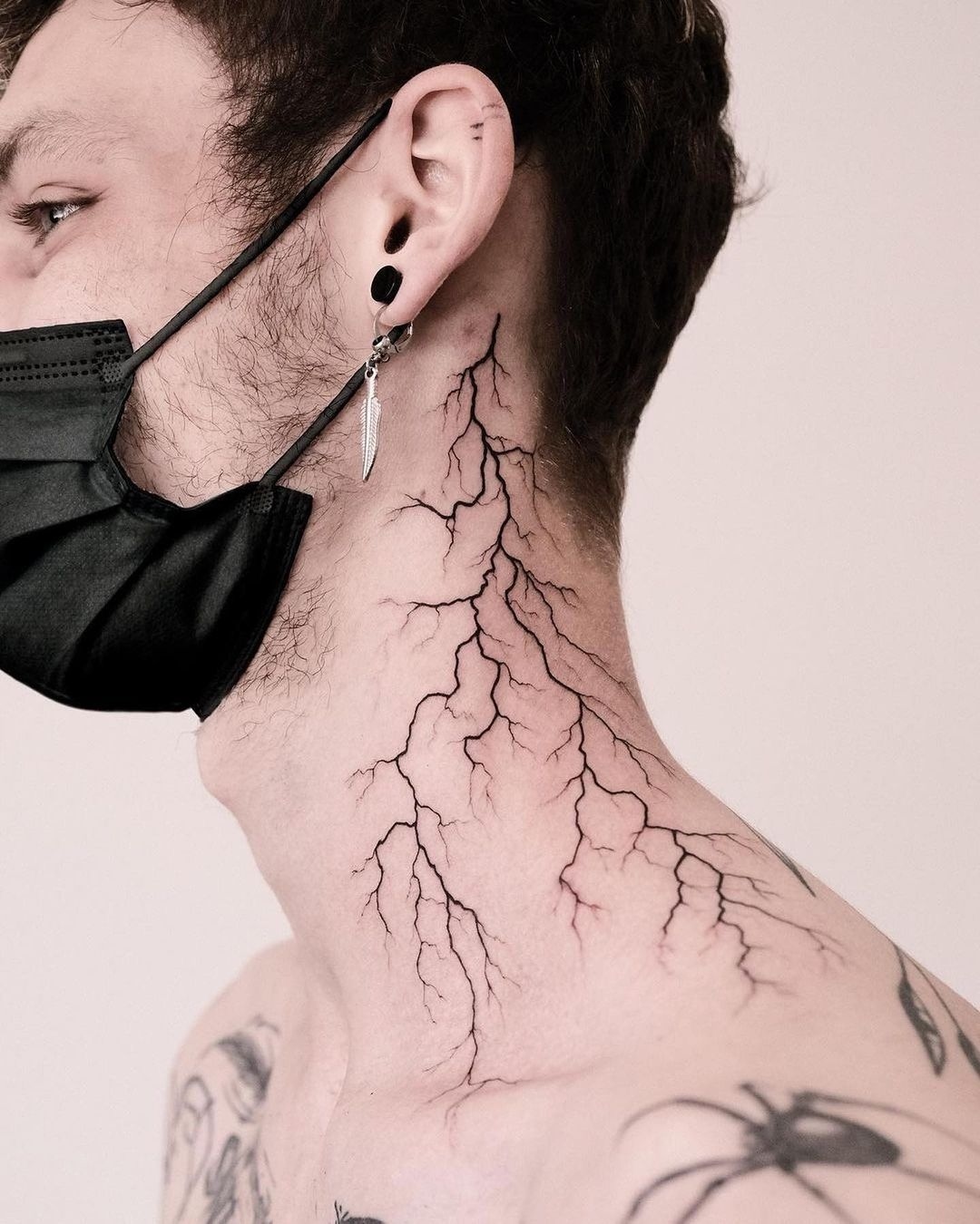 Striking lightning bolt tattoo on neck