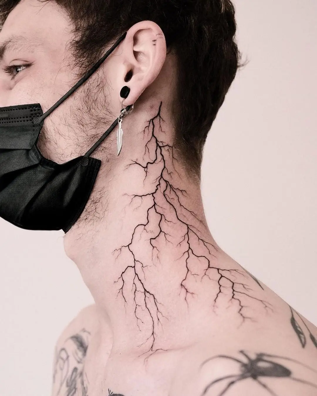 Striking lightning bolt tattoo on neck