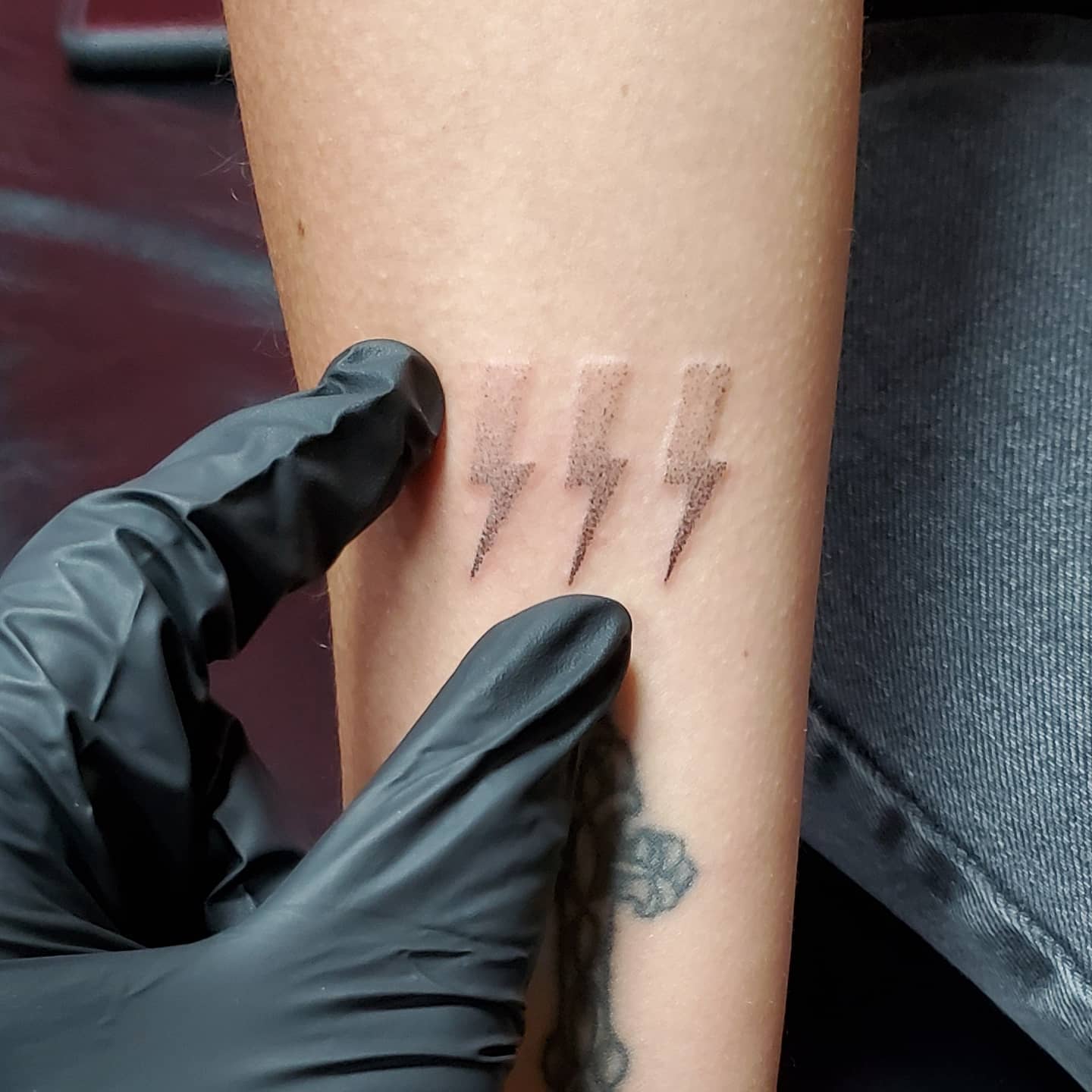Stylish minimalist lightning bolt tattoo design