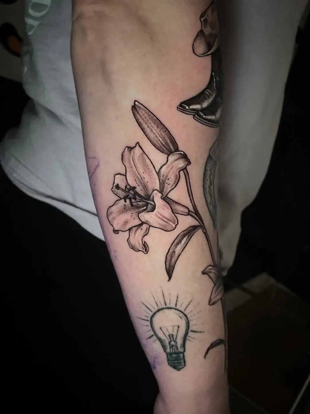 Unique lily tattoo with creative light bulb