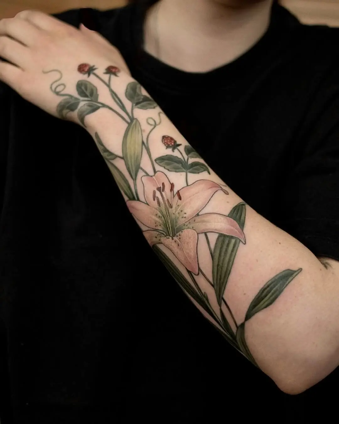 Stunning floral lily tattoo on the arm