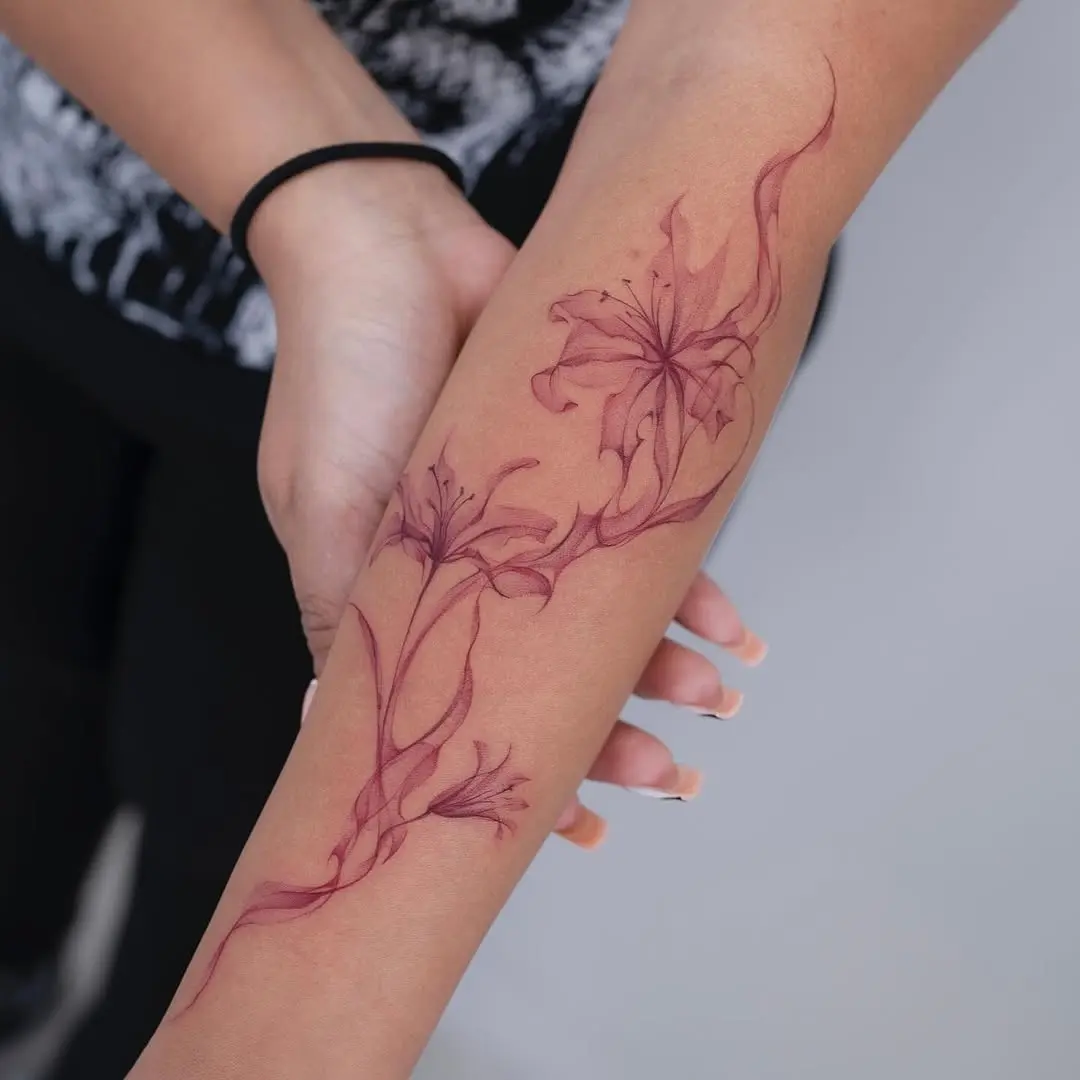 Elegant lily tattoo design on the arm