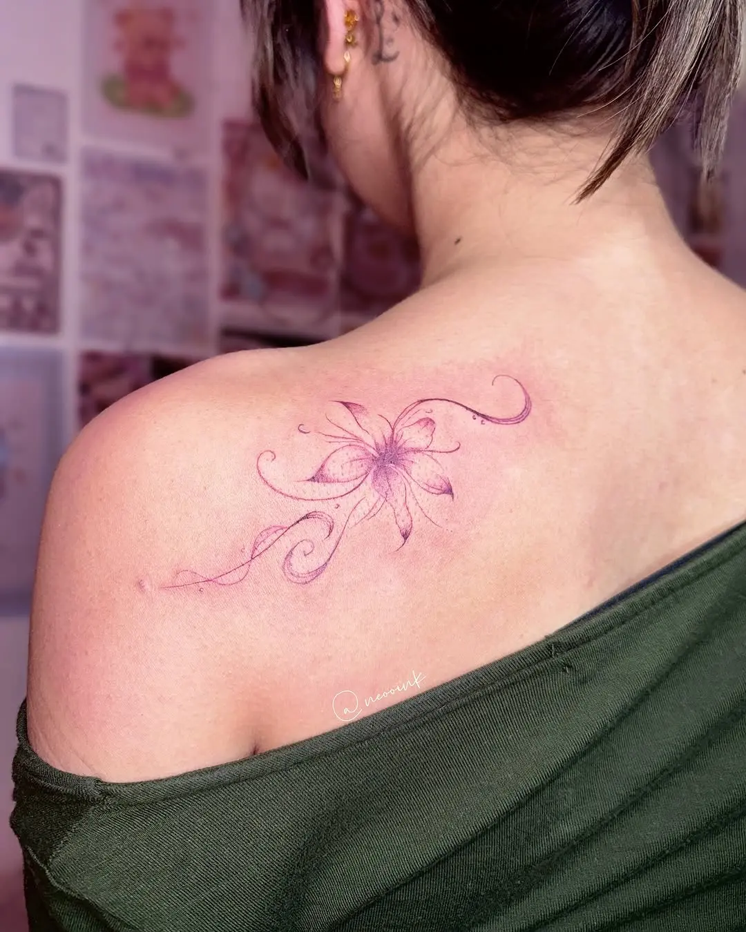 Delicate ink of a purple lily tattoo
