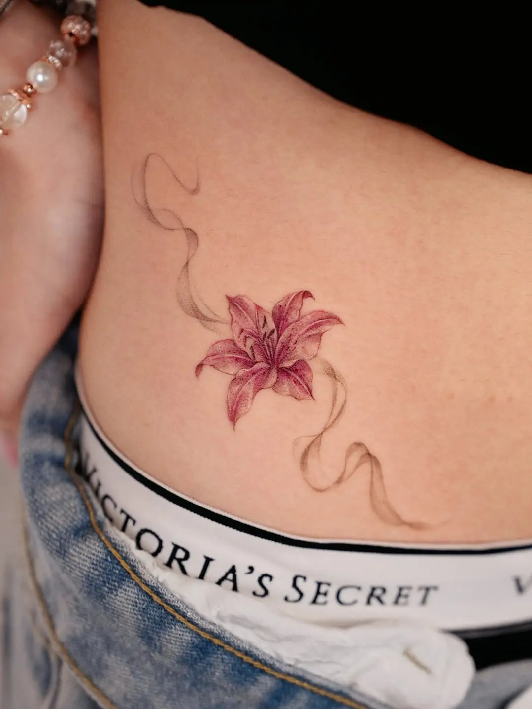Delicate Side Lily Tattoo with Flowing Lines