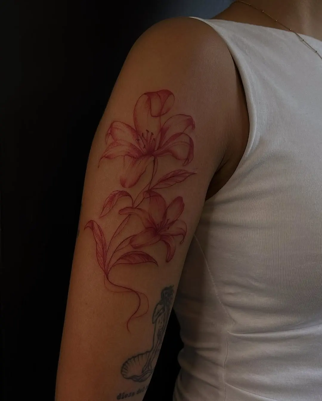 Elegant lily tattoo on a woman's arm