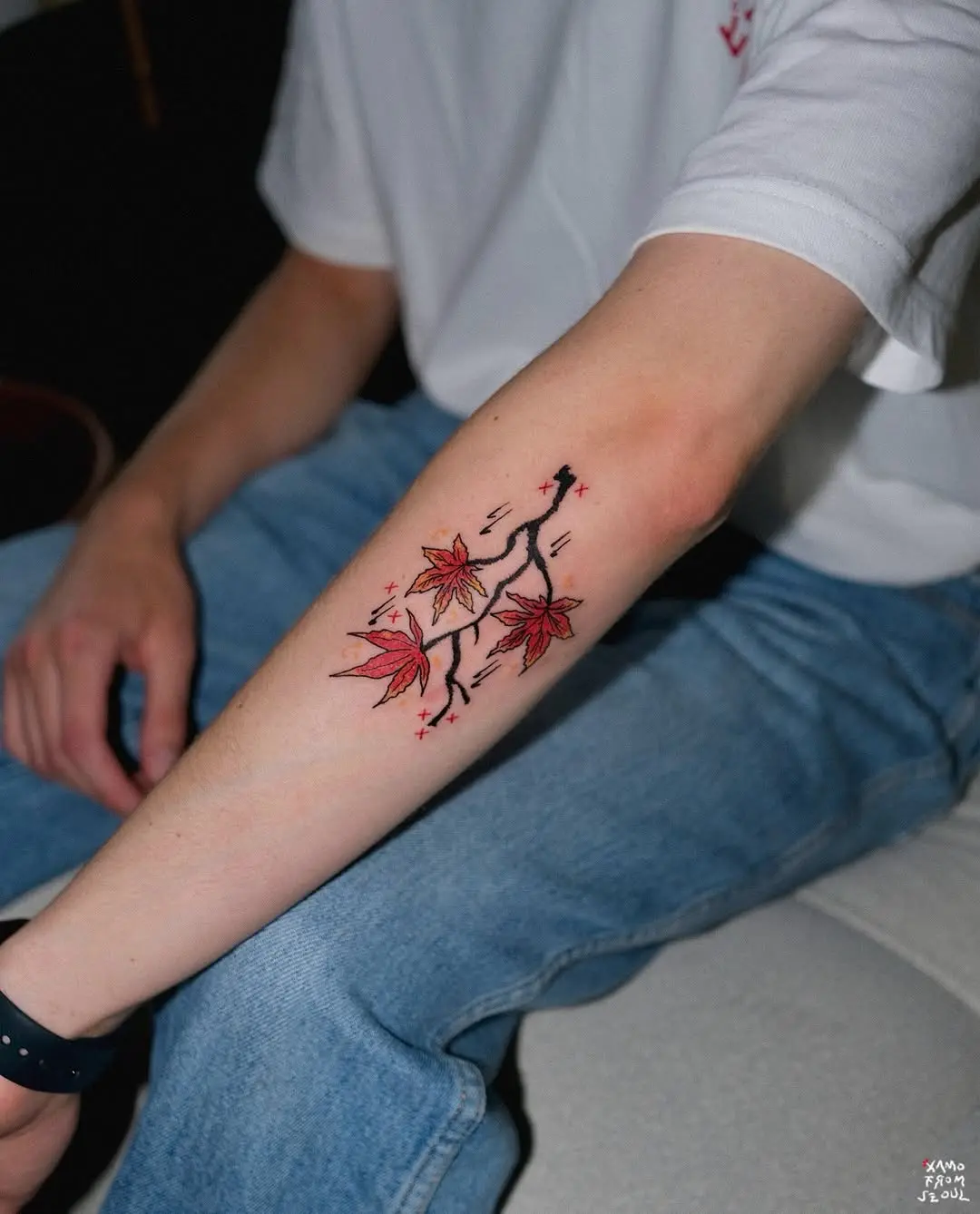Vibrant Maple Leaf Tattoo Design on Forearm
