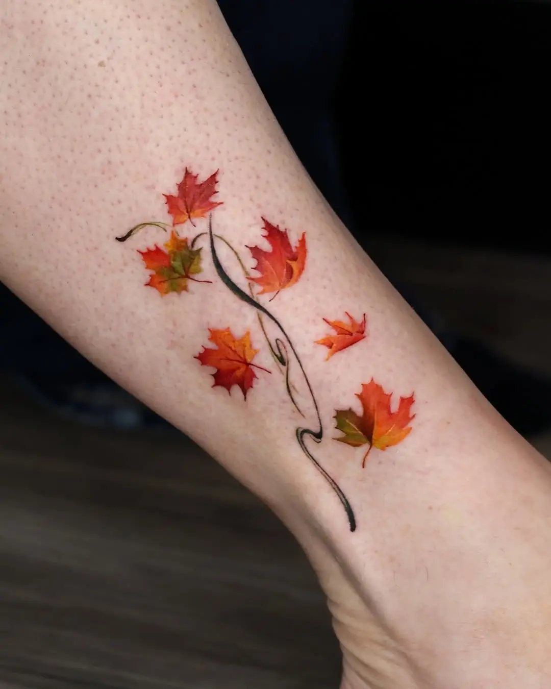 Vibrant Maple Leaf Tattoo with Natural Flow